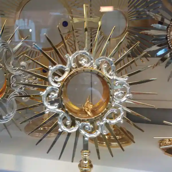 Cross on top of a solar disc being sold around St. Peter Basilica